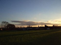 Sky behind a school somewhere.
